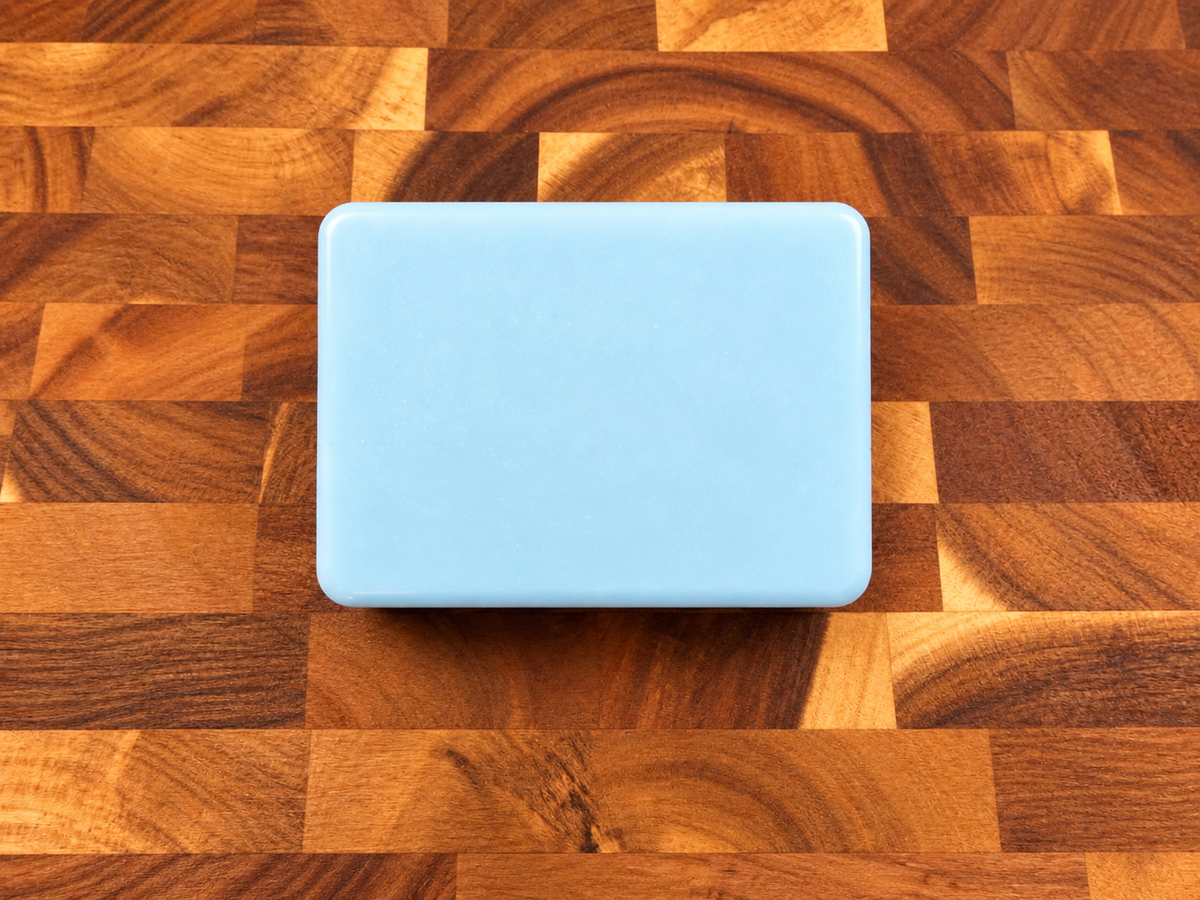 Noor Skin light blue triple butter soap on butcher block