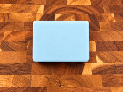Noor Skin light blue triple butter soap on butcher block